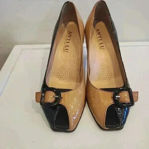 Anyi Lu peep toe pumps in black and tan